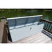 American Feeder DB-8020 Dock Box open on a wooden dock beside a pond, lid raised showing rod holder brackets and latch
