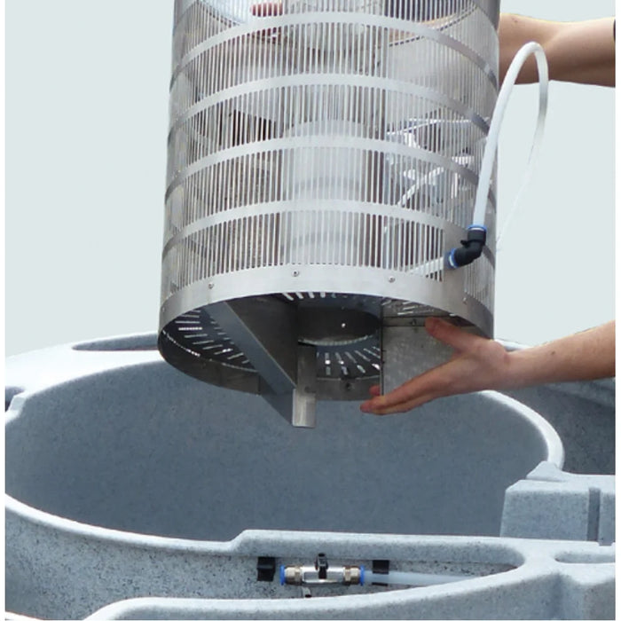 Hands lifting the stainless mesh Eazy cartridge from the Nexus+ Nexus 220+ EAZY filter housing during cleaning