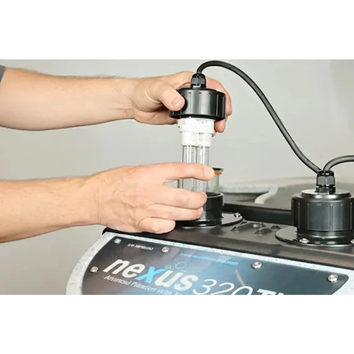 Hands removing a serviceable titanium UV lamp from the Evolution Aqua Nexus EAZY 320 Titanium Pond Filter control lid