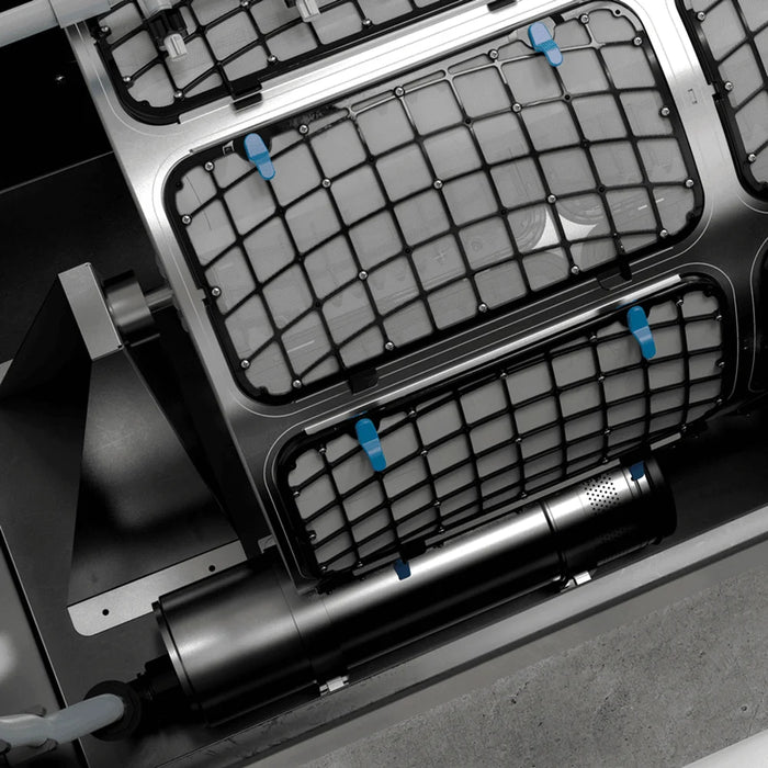 Mesh screen panels, drive shaft and cleaning pump seen inside the drum of the Oase ProfiClear Premium XL-Pump Fed