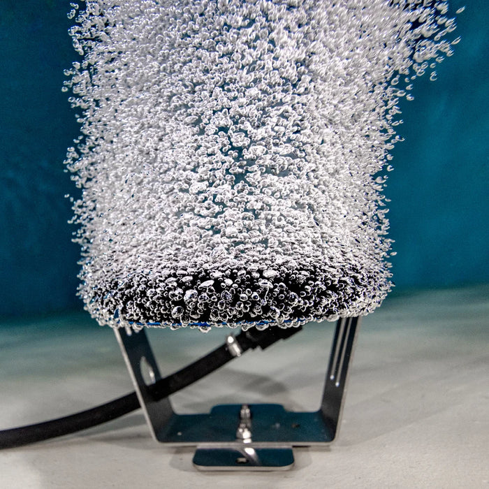 Underwater view of Kasco Marine Home Series Diffused Aerator single-loop diffuser releasing fine bubbles from the pond bottom