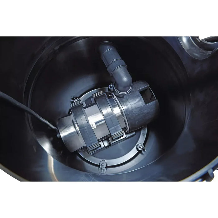 Close-up inside the Oase PondoVac 5 Sludge Vacuum tank showing the integrated silt pump and discharge elbow for continuous drainage