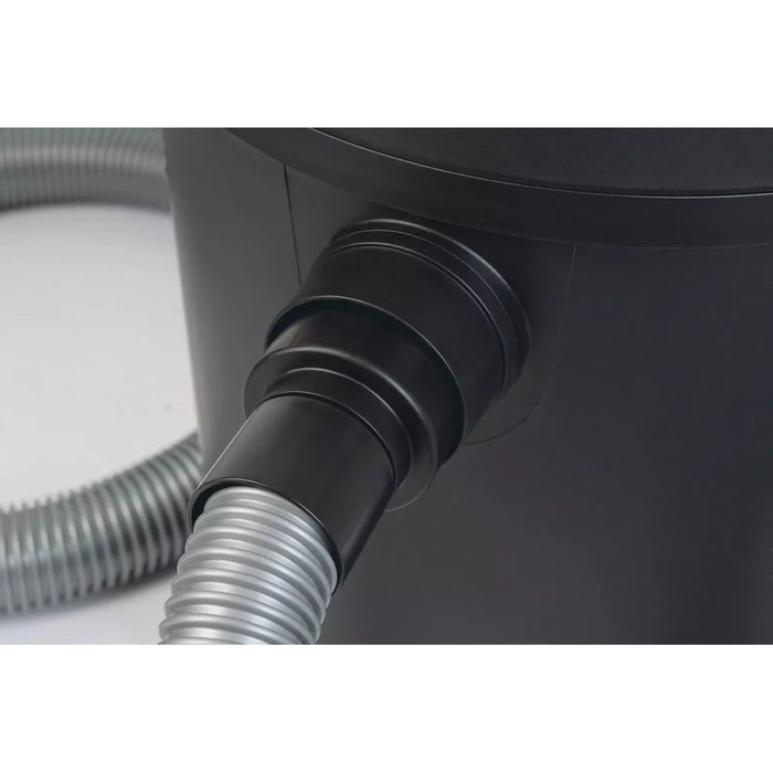 Close-up of the Oase PondoVac Classic pond vacuum plug connection with the grey suction hose fitted into the tank inlet