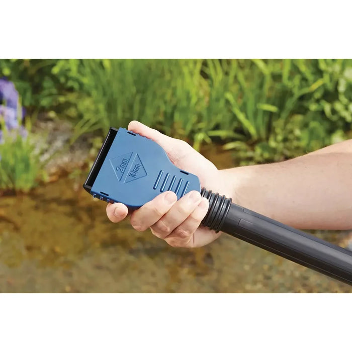 Hand holding the Oase PondoVac Classic blue variable universal nozzle showing the 2 mm to 10 mm adjustable gap markings