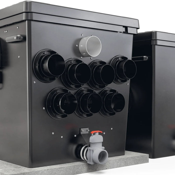 Rear of the Oase ProfiClear Premium XL Gravity showing seven inlet ports and slide valve drain