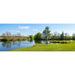 Clear healthy pond with the Outdoor Water Solutions Steel Windmill Aerator 3 Leg working on the green bank