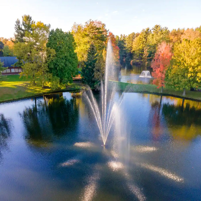 scott_aerator_atriarch_pond_fountain_in_water_with_building_and_trees_in_background