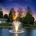 scott_aerator_warm_white_led_night_glo_pond_fountain_lights_in_water_with_trees_in_background