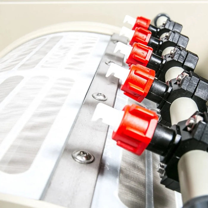 Close-up of red rinse nozzles and stainless sieve panel on the Sea Side Aquatics Entry C25 Drum Filter