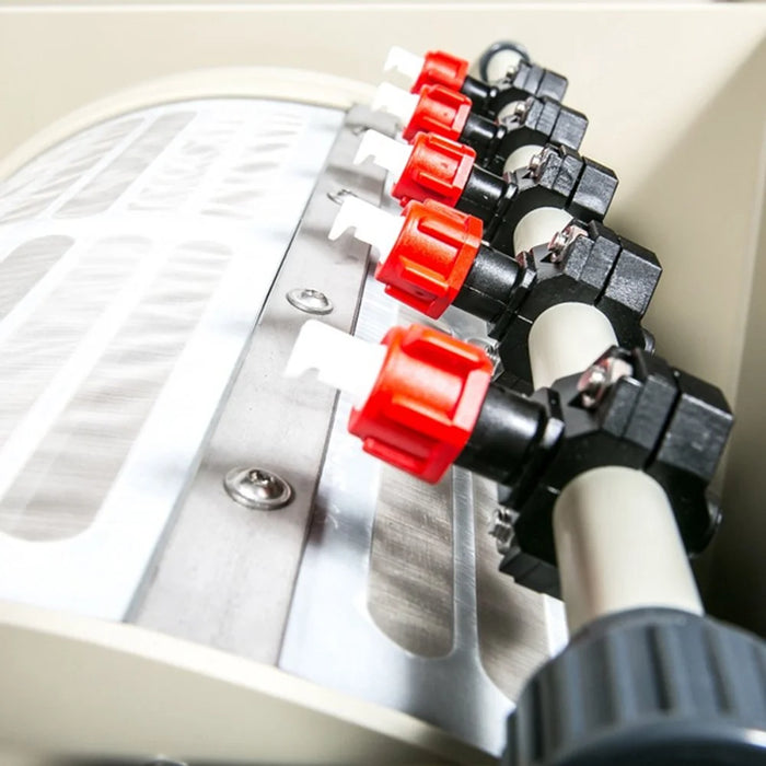 Close-up of the Sea Side Aquatics Entry M25 stainless steel drum sieve panel and red-valve spray bar assembly
