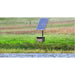 Solaer® Solar Pond Aerator cabinet and tilted panel installed in a grassy field beside a rural pond