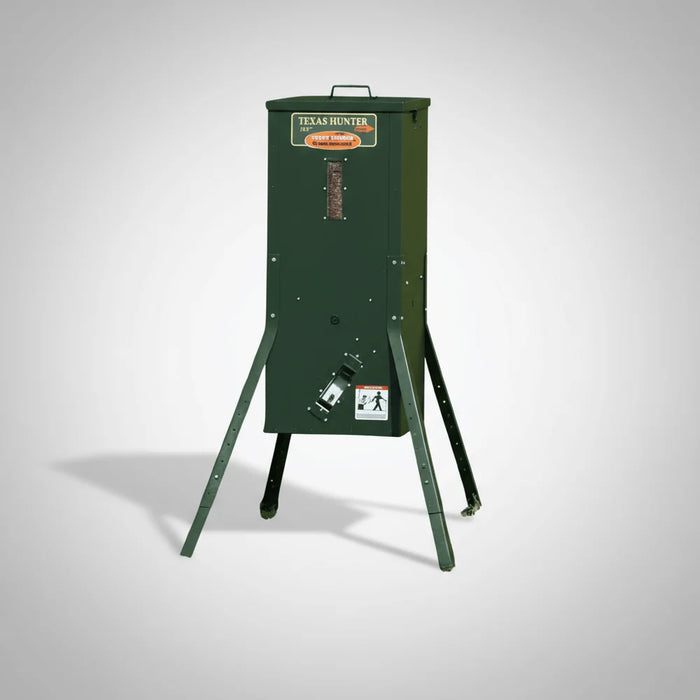 Dark green Texas Hunter Solar-Powered Fish Feeder for Pond with four splayed legs and feed window on white studio background
